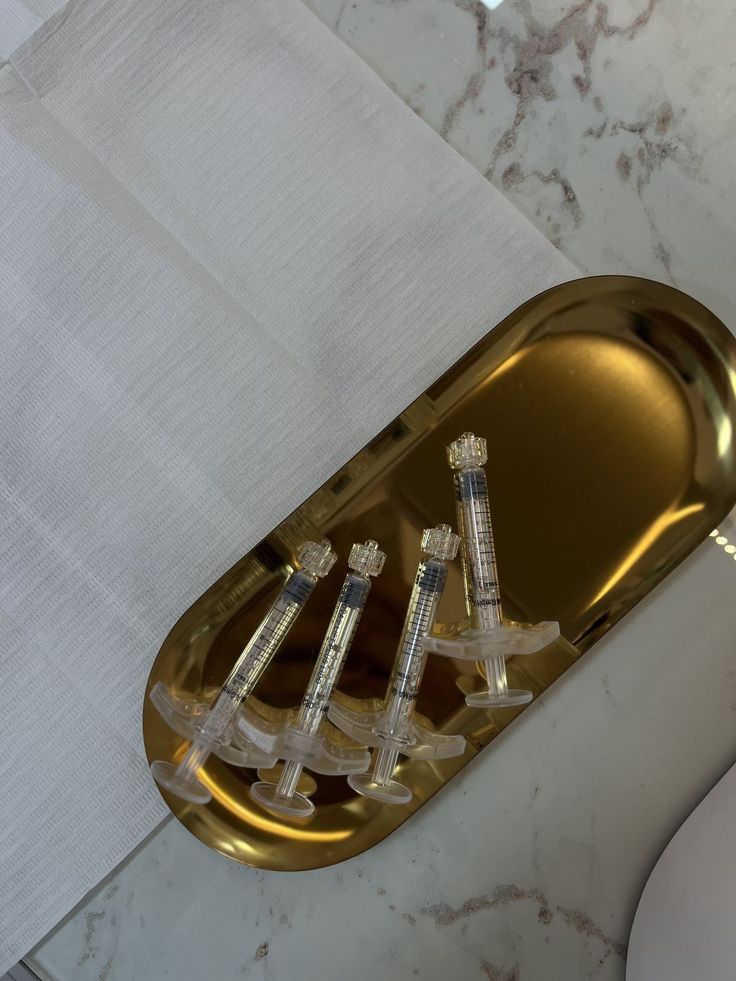 Stainless tray with neatly arranged aesthetic syringes
